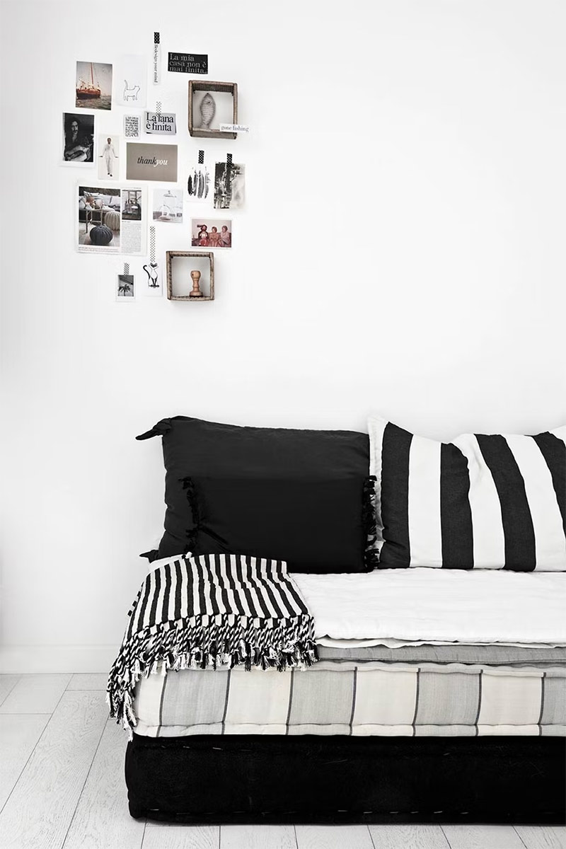 Un loft au style scandinave avec des accents tribaux en noir et blanc